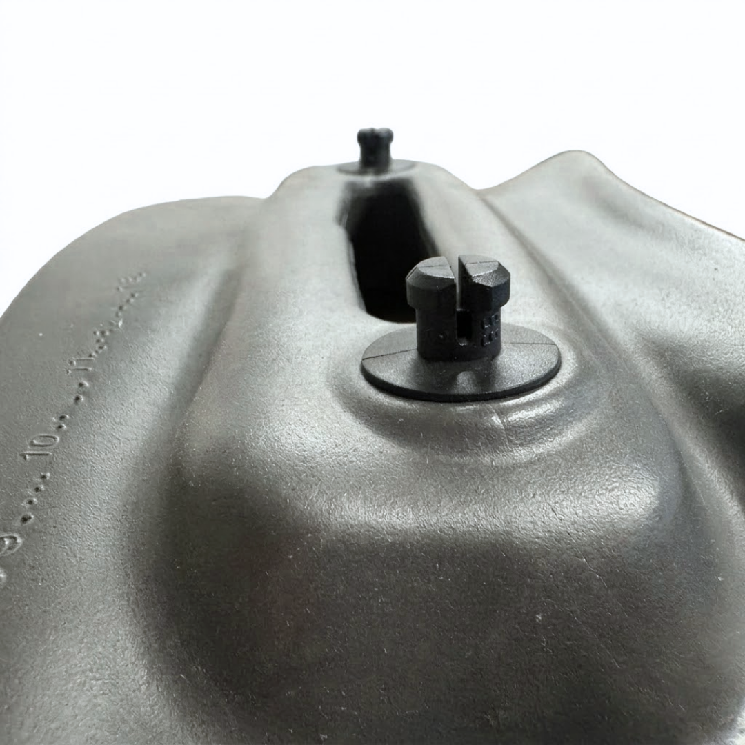 Close-up angled rear view of an Artesian Spas Platinum Elite series 11-inch headrest pillow in charcoal gray, focusing on the mounting pegs and rear structure.