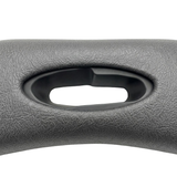 Close-up texture view of an premium Artesian Spas Platinum Elite series 11-inch replacement headrest pillow in dark charcoal gray, highlighting the textured material and central oval cutout.