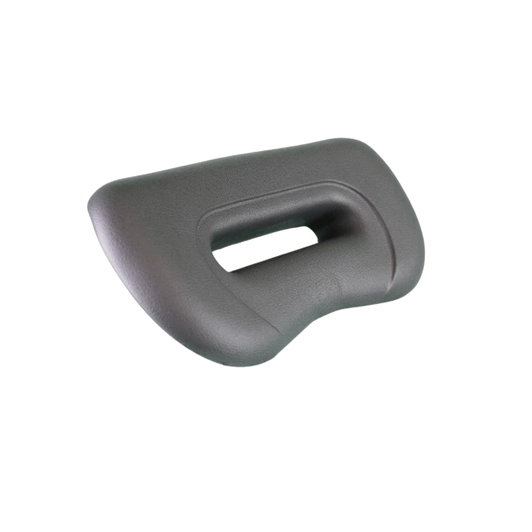 Side angle perspective view of an Artesian Spas Platinum Elite series replacement 12-inch waterfall headrest pillow in dark charcoal gray, highlighting its curved ergonomic design and central opening.