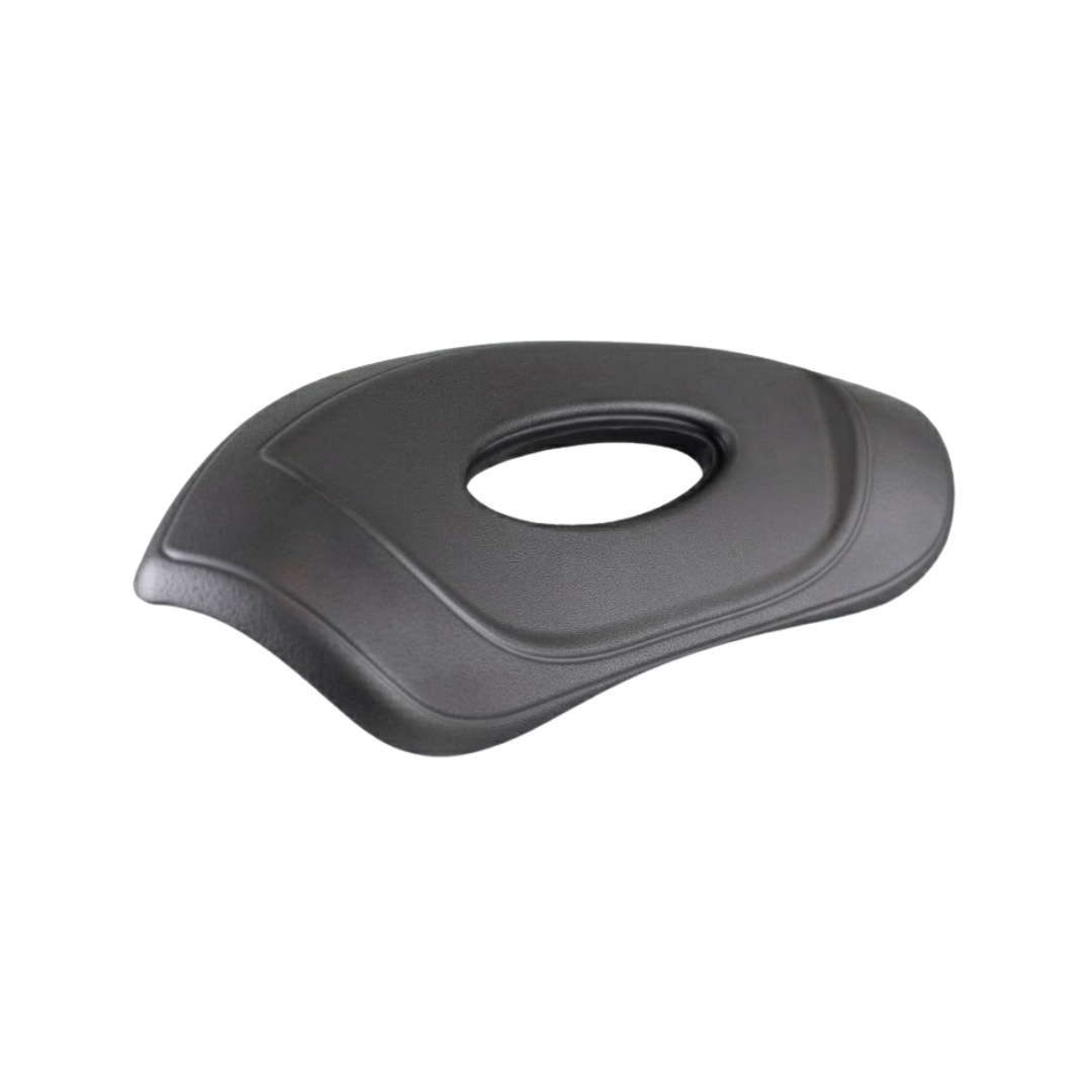 Side angle perspective view of an Artesian Spas Platinum Elite Lounge series replacement 16-inch headrest pillow in dark charcoal gray, highlighting its curved ergonomic contouring and center oval opening.