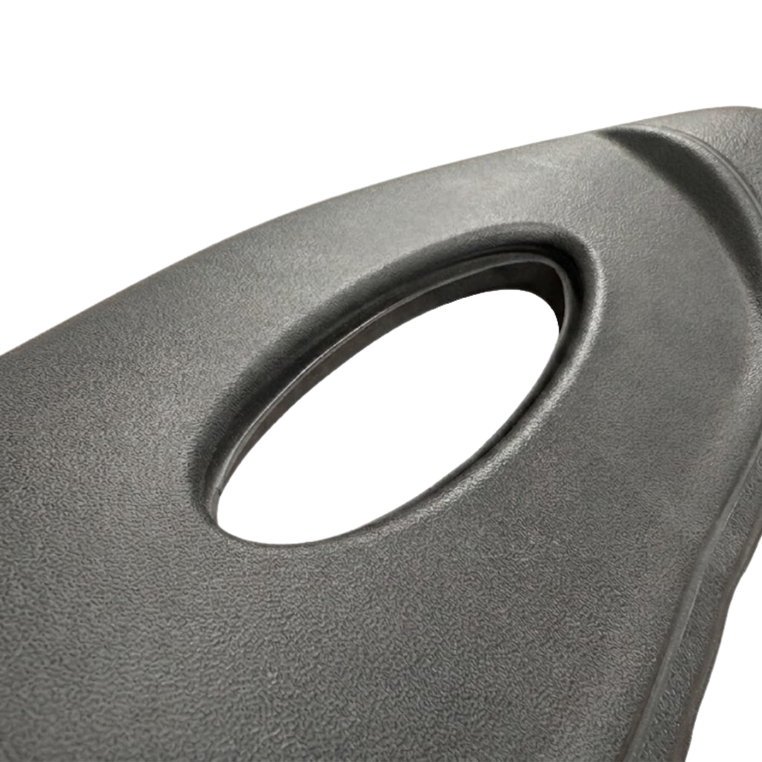 Close-up texture view of a premium Artesian Spas Platinum Elite Lounge series replacement 16-inch headrest pillow in dark charcoal gray, highlighting the textured material and central oval cutout.