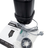 High-angle view of a black AstralPool SX1200 single speed spa air blower shown with connected grey power cord, standard 3-pin plug, bagged installation accessories, and printed manual isolated on white.