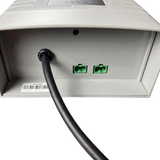 Underside view of an AstralPool Halo Lite 2 controller showing the black power cable entry, a product barcode label, and two green plug ports labeled Light 1 and Light 2.