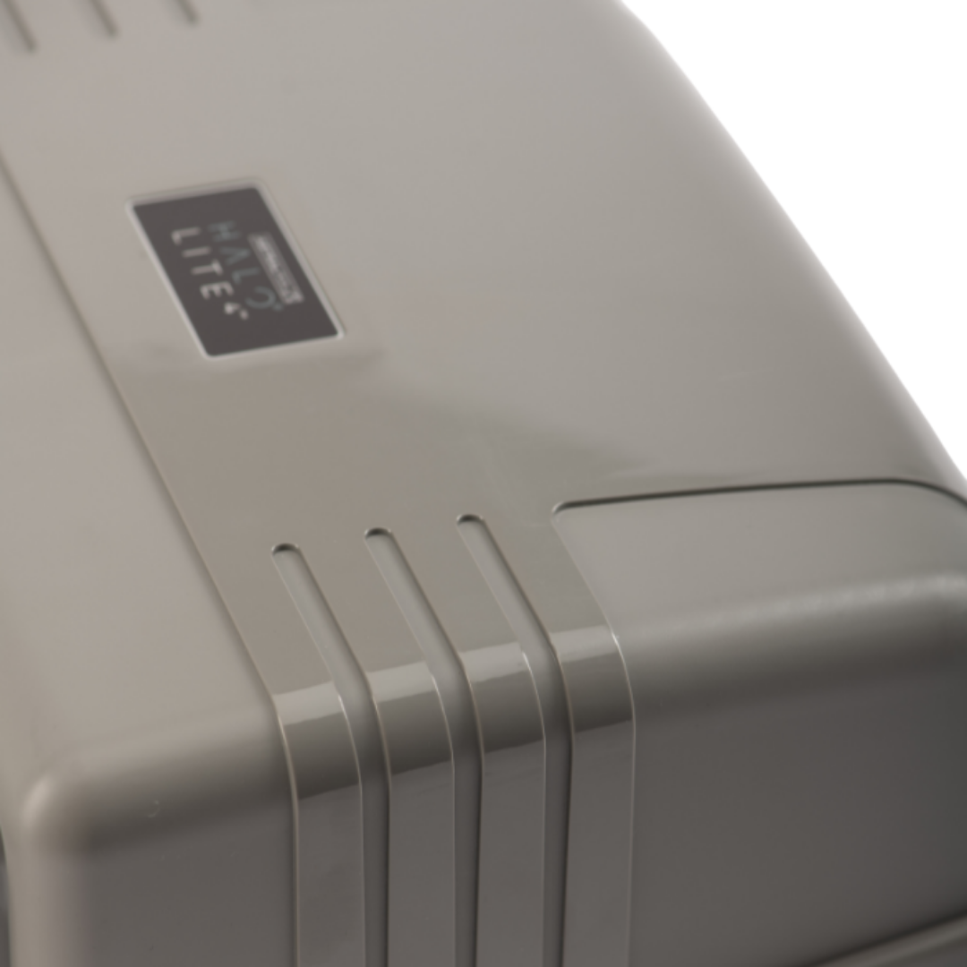 Close-up high angle view of the durable grey plastic casing on an AstralPool Halo Lite 4 pool light controller, highlighting the design details and the product logo badge.
