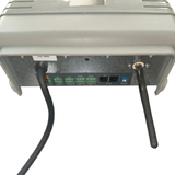 Underside view of an AstralPool Halo Lite 4 controller showing a black power cord, four green ports labeled Light 1 through Light 4, two RJ12 ports, a zone switch, and an attached black wireless antenna.