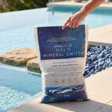 A bag of AstralPool Halo Mineral Switch 10kg magnesium blend resting poolside, used to quickly convert chlorine or saltwater pools to a mineral oasis.