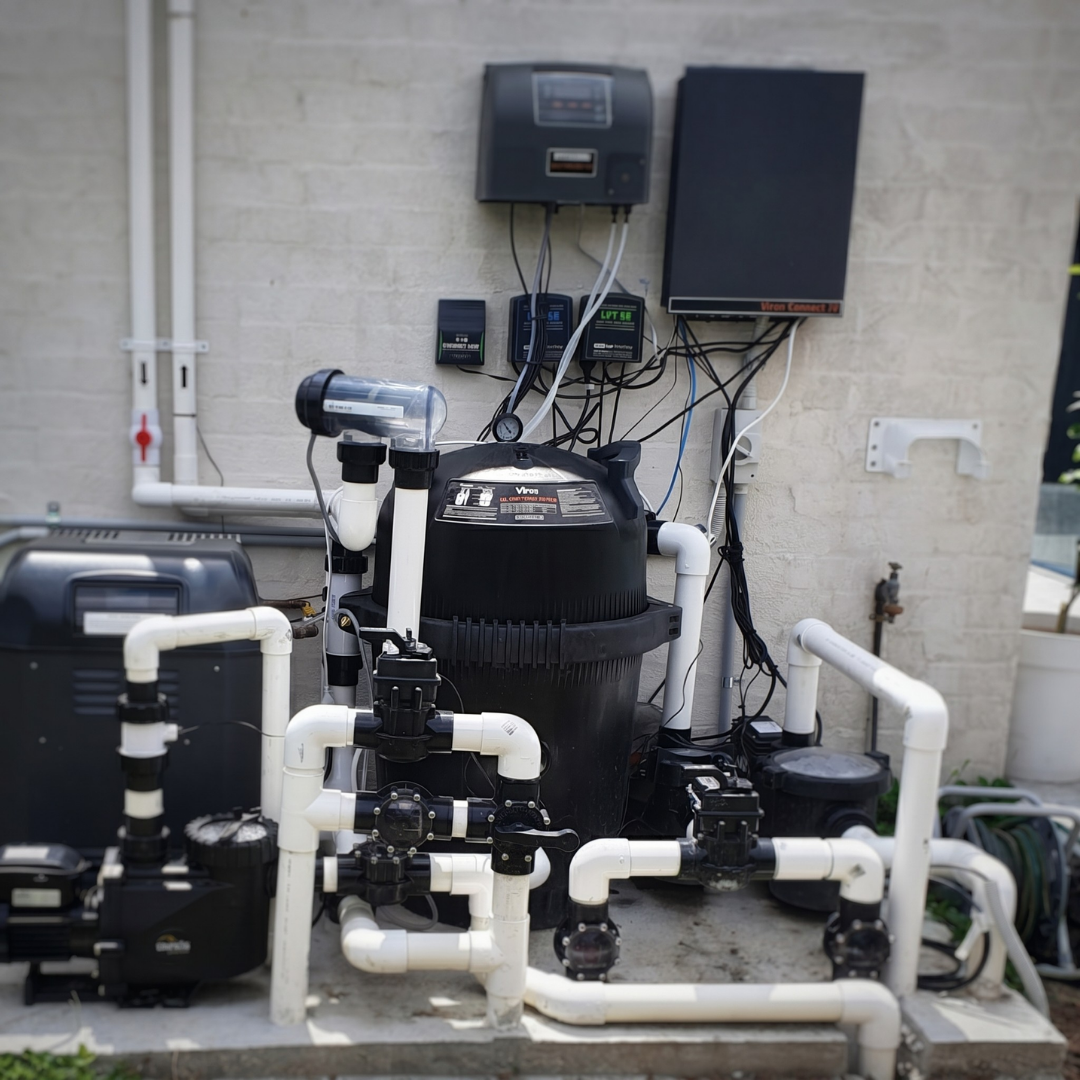 Complete pool equipment pad setup featuring an AstralPool Viron QL420 cartridge filter tank integrated with a Viron Connect automation controller box a gas heater pool pump and complex PVC valve manifold plumbing