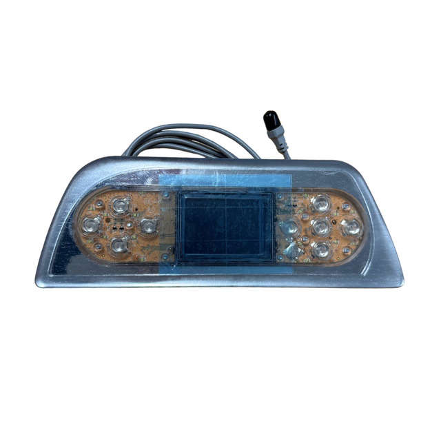 Front view of an unbranded Balboa TP800 replacement touchpad control panel for Artesian Island Spas, showing the clear protective overlay, raw circuit board with button contacts, central digital display window, and attached connection cable.