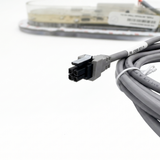 Close-up detail of the black 4-pin connector plug on a grey coiled data cable for a Balboa TP800 TidalFit spa controller panel, with part number label 52659 Rev D visible.