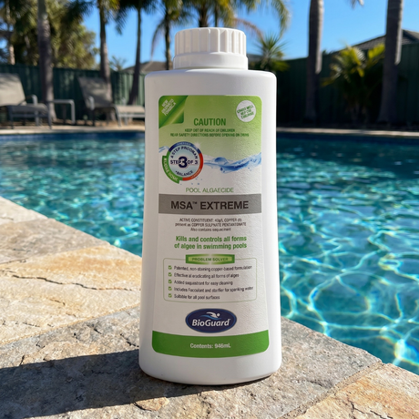 BioGuard MSA Extreme Pool Algaecide 946mL bottle sitting poolside, featuring a copper-based formula to kill and control all forms of swimming pool algae.