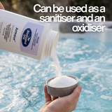 BioGuard SPA Armour dual-action granules being poured into a dosing cap over a bubbling spa. Text overlay confirms the product can be used as both a sanitiser and an oxidiser for hot tub water maintenance.