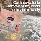A hand holding a 50g sachet of BioGuard Spa Purity Oxidiser above a bubbling, steaming hot tub, with text overlay explaining that it oxidises water to remove musty odors and maintain clarity.