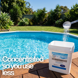 A scoop of BioGuard Swim Clear being measured from a 2.1kg bucket poolside with text: "Concentrated so you use less," highlighting the efficiency of this stabilized pool sanitizer.