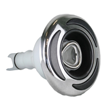 Three-quarter front profile view of a C-Helix 3 Directional SS spa jet internal insert, showing its stainless steel bezel with three black crescent accents, central eyeball-style directional nozzle, and white plastic rear stem.