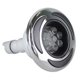 Three-quarter front profile view of a C-Helix 3 MSSG SS spa jet internal insert, showing its stainless steel bezel with black crescent accents, multi-port clear massage nozzle cluster, and white rear stem.