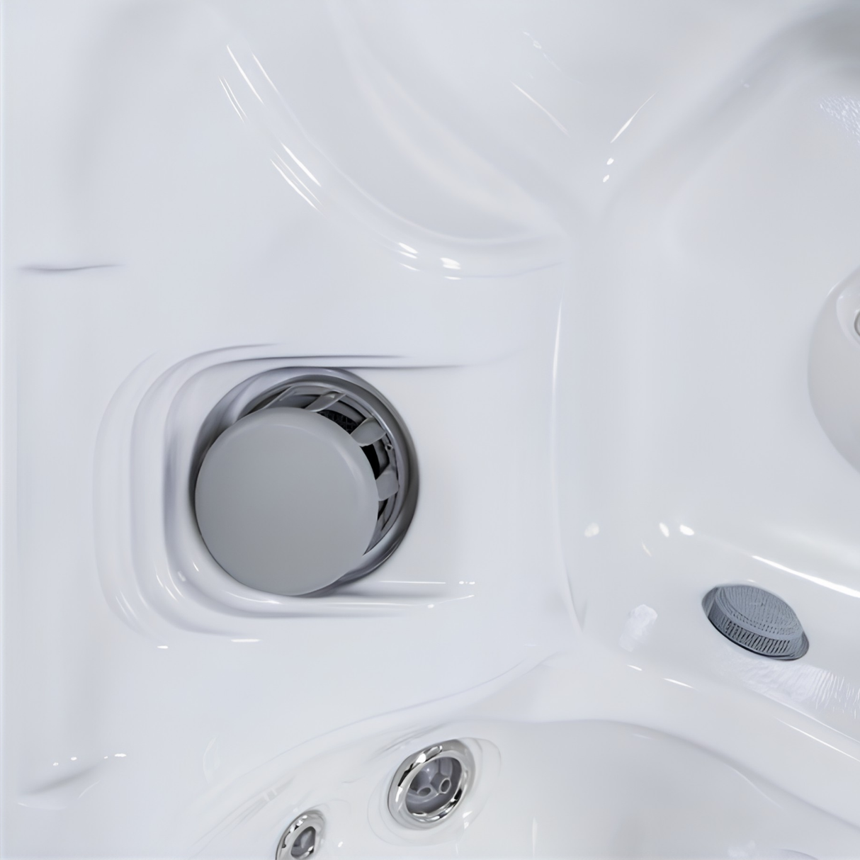 Grey CMP filter safety vane weir replacement cap installed inside a white acrylic spa skimmer housing next to spa jets and suction fittings.