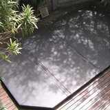 Heavy-duty custom hard cover for a backyard swim spa on a timber deck