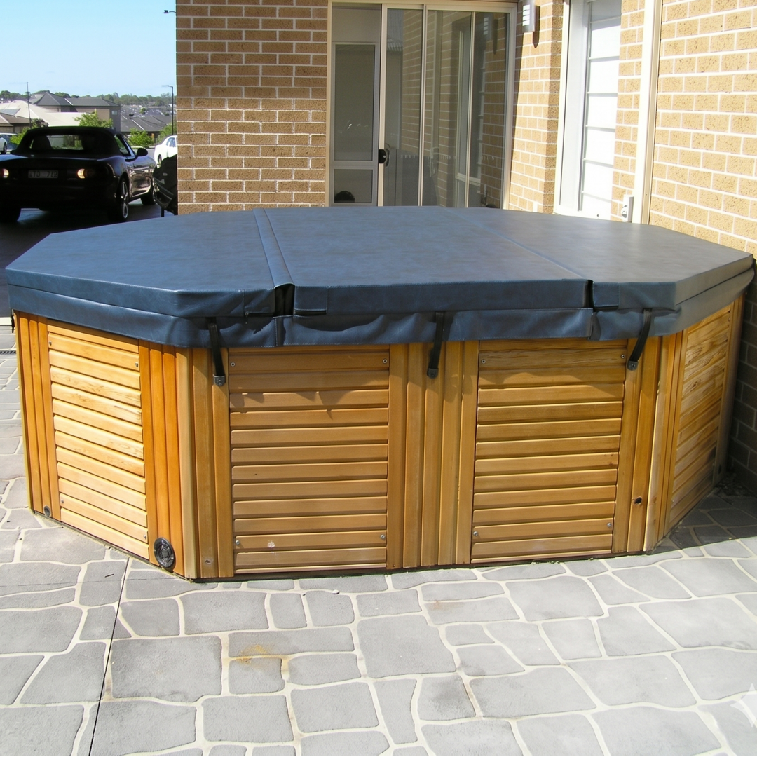 Oversized custom spa hard cover, greater than 2350mm, installed on a multi-panel outdoor hot tub.