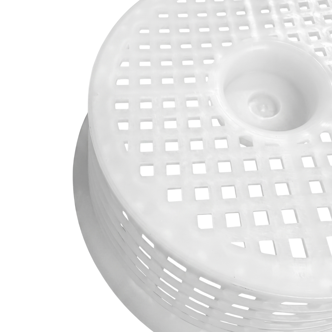 Macro close up view of the upside down base of a white plastic Davey 1000 Series small pool skimmer basket highlighting the square drainage perforations and structural rim