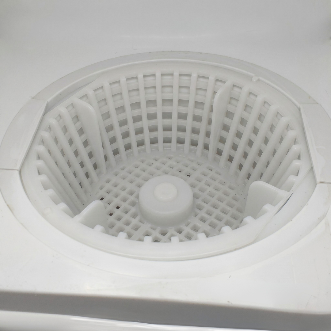 Top view looking down at a white plastic Davey 1000 Series small pool skimmer basket fully installed inside a white skimmer box housing