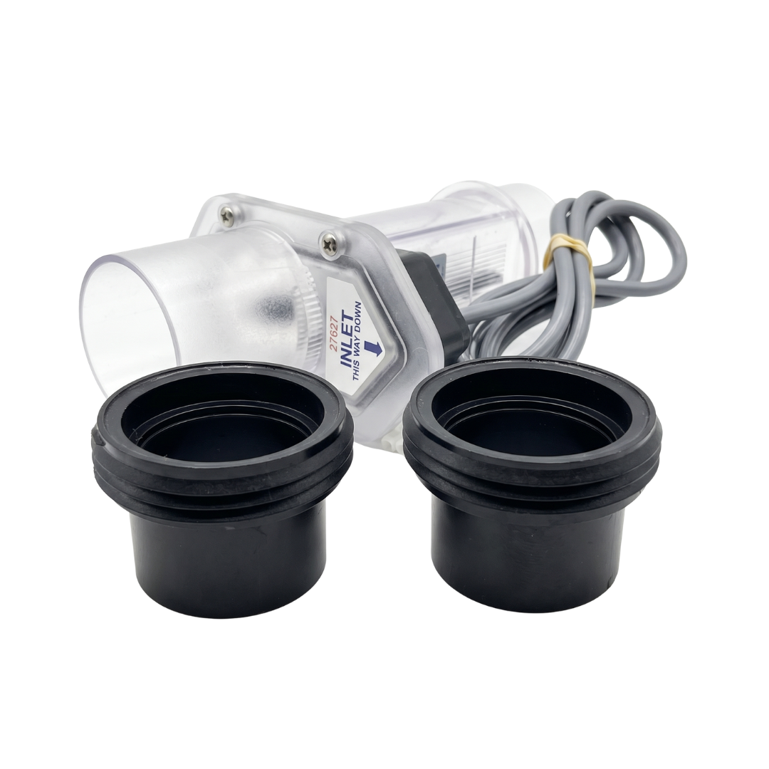 Replacement Davey Eco Spa salt chlorinator electrolytic cell kit, showcasing two black plastic union tail pieces in the foreground and the clear cell housing with a "27627 INLET THIS WAY DOWN" directional label.