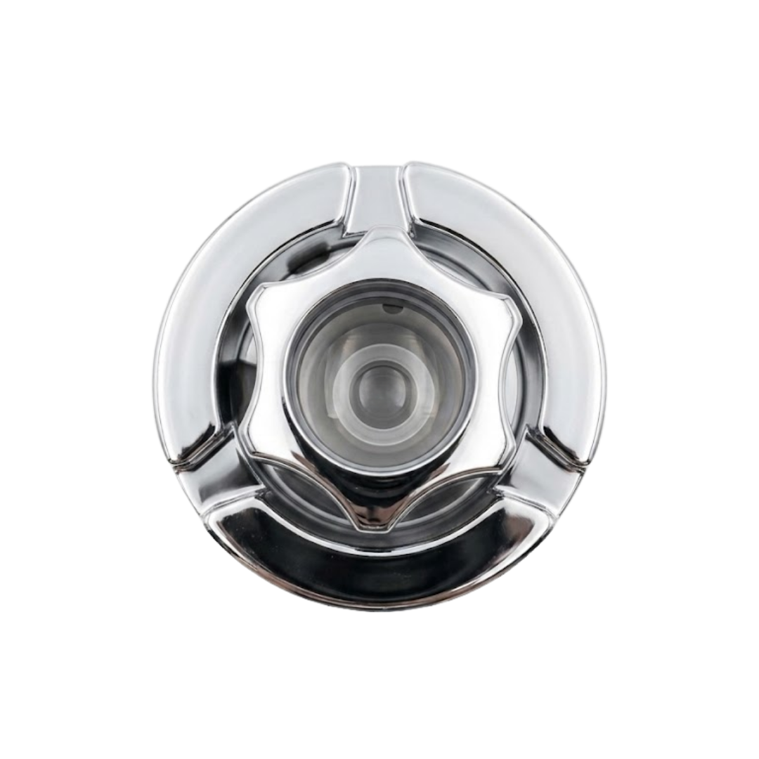 Top-down view of a chrome directional internal SL spa jet showing the star-shaped adjustable nozzle bezel.