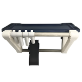 An empty The Rack wall-mounted swimming pool and spa equipment organiser featuring a navy blue top storage tray, white frame supports, four accessory hanging clips, and a central black vacuum hose strap against a white background.