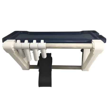An empty The Rack wall-mounted swimming pool and spa equipment organiser featuring a navy blue top storage tray, white frame supports, four accessory hanging clips, and a central black vacuum hose strap against a white background.