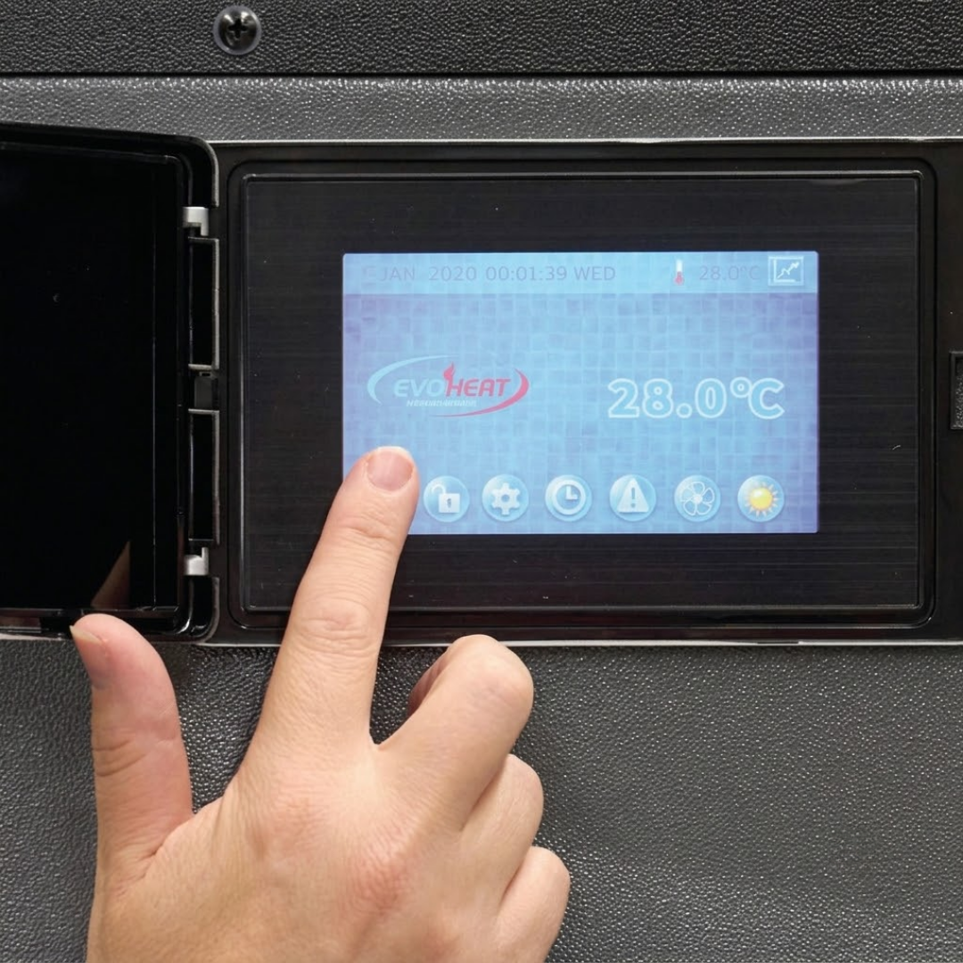 Close-up view of a hand interacting with the color digital touchscreen control panel of an EvoHeat Force iPro series pool heat pump, housed behind an open protective hatch on the textured grey casing.