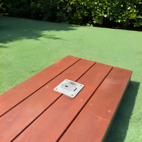 Low-profile marine-grade stainless steel EzyHold deck mount plate bolted flush onto timber decking with the vertical umbrella holder sleeve removed.
