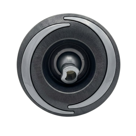 Direct overhead front view of a Halo 4.5 ROTO plastic spa jet internal insert, featuring a dark textured face with two curved light grey accent arcs and a central directional rotational nozzle.