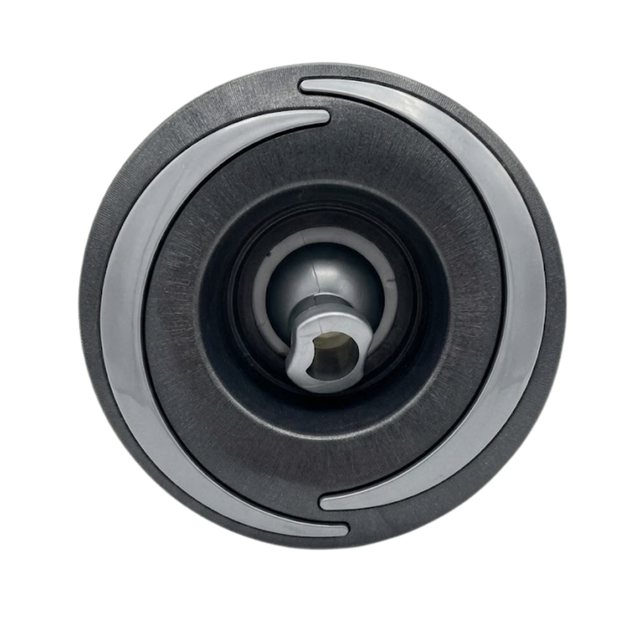 Direct overhead front view of a Halo 4.5 ROTO plastic spa jet internal insert, featuring a dark textured face with two curved light grey accent arcs and a central directional rotational nozzle.
