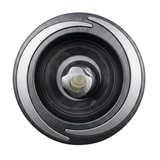 Direct overhead front view of a Halo 5 ROTO plastic spa jet internal insert, featuring a textured black bezel with three silver crescent accents and a central rotational nozzle.