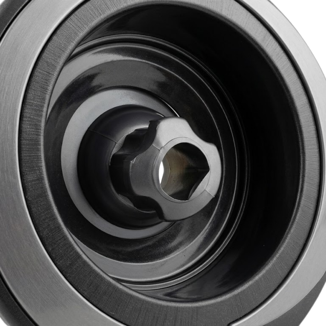 Close-up view of the central rotational nozzle on a Halo 5 ROTO plastic spa jet internal insert, showing its sculpted star-shaped nozzle head within a textured black bezel.