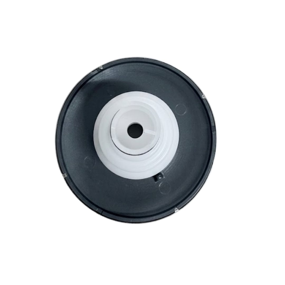 Direct overhead bottom-up view of the rear of a Helix 4.5 ROTO stainless steel spa jet internal insert, showing a dark grey circular outer flange back and a central white plastic intake port opening.