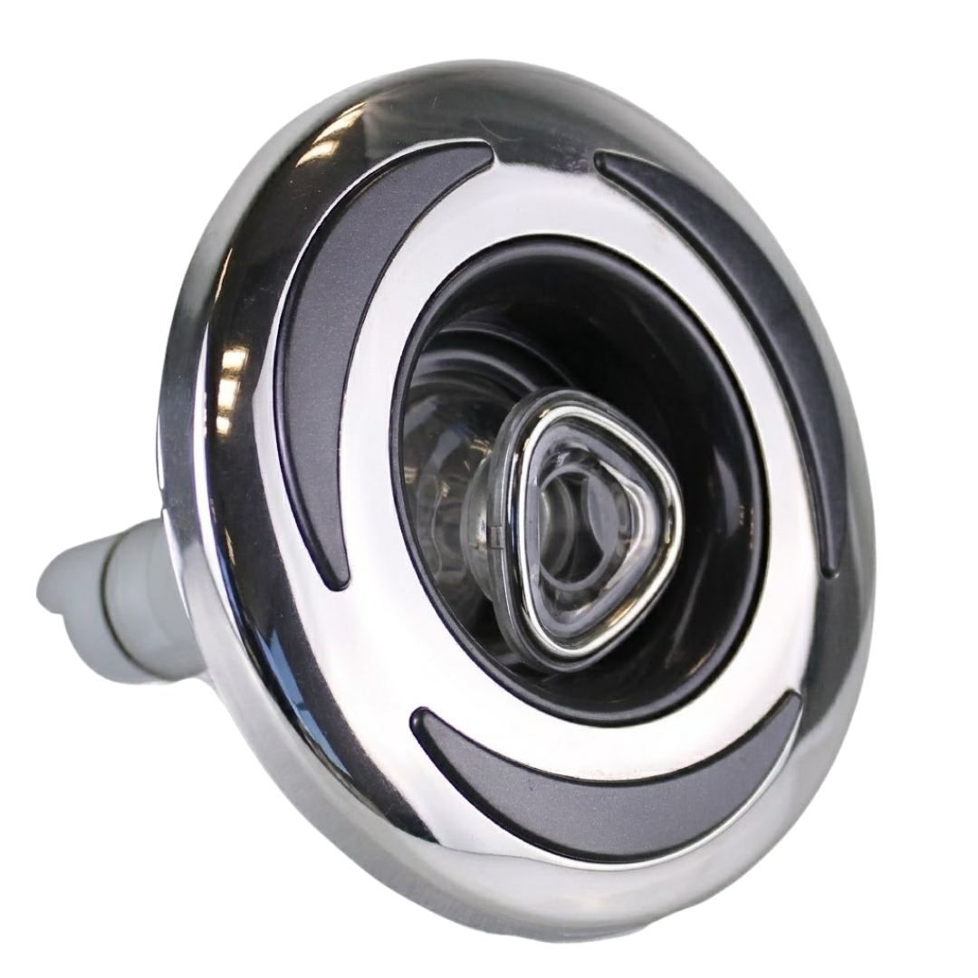 Three-quarter angled studio view of a Helix 4.5 ROTO stainless steel spa jet internal insert, featuring a polished metal bezel with three dark grey crescent accents, a central clear rotational nozzle, and an extending rear stem.