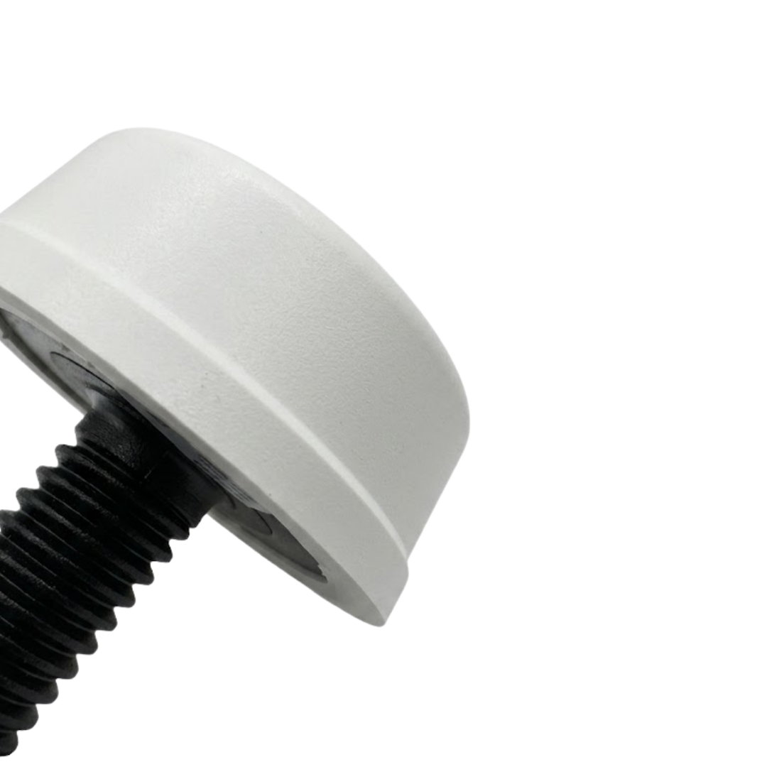 A macro close up profile view of a white Herga spa air button showing the finely textured round bellows push cap attached to the black threaded stem collar