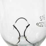 Extreme macro close-up view of the fine coiled tungsten filament wire and lead-in supports inside an inground spa GE912 12V light globe.
