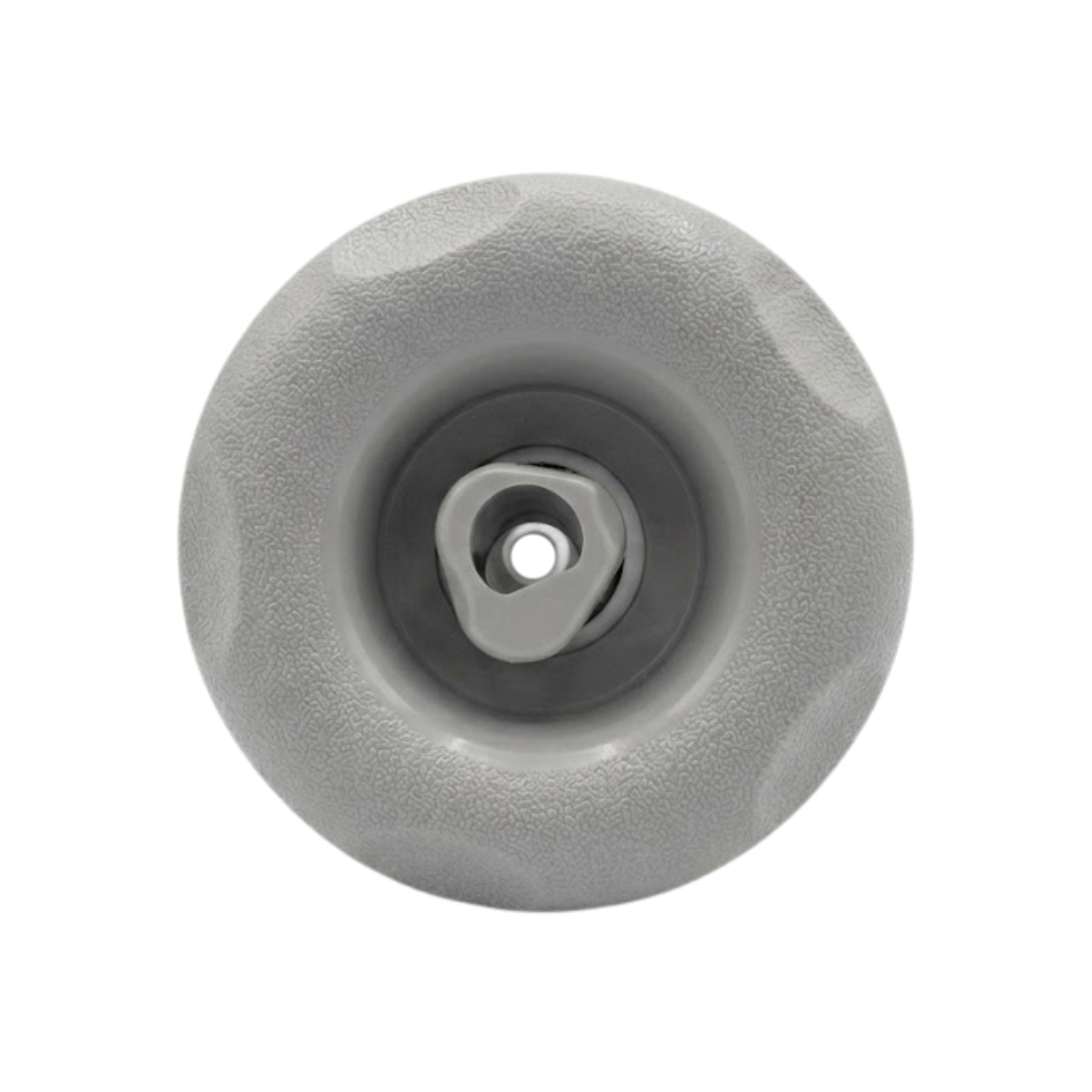 Direct overhead front view of a Jet Cyc Luxury Adj Swirl Emerald 3.5 spa jet insert, featuring a textured light grey scalloped bezel and a dark grey internal housing with a central rotational swirl nozzle.