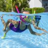 Two young children swimming underwater in a backyard pool wearing Bestway Hydro-Swim Lil Flapper snorkel masks, fins, and snorkel tubes