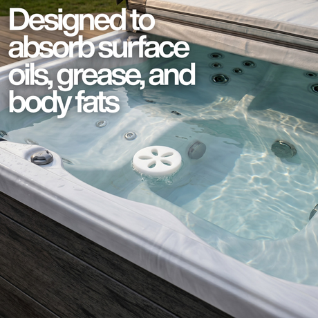 A white Life Spa Disc oil-absorbing sponge floating freely in the clear water of an outdoor hot tub. Text overlay reads, "Designed to absorb surface oils, grease, and body fats."