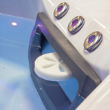 A close-up shot of a white Life Spa Disc oil-absorbing sponge floating inside the skimmer filter box of a clean, blue water hot tub.