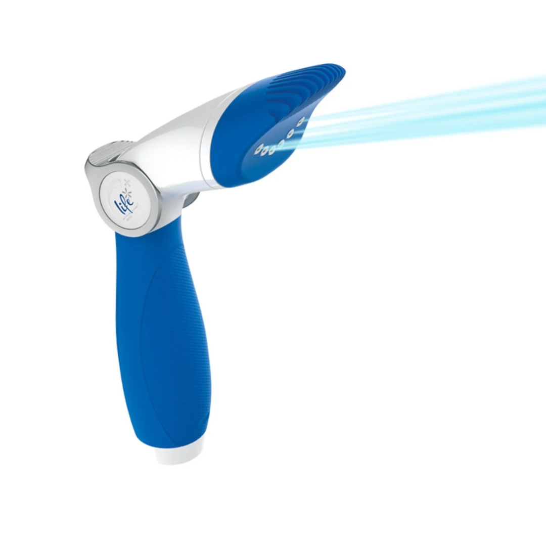 A studio product shot of the blue and white Life Water-Wand Pro cartridge filter cleaning tool isolated on a white background, featuring blue graphic streams emitting from its comb-like nozzle to simulate a high-pressure water spray.