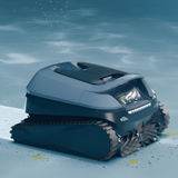 Underwater view of a Maytronics Dolphin Eon 100 cordless robotic pool cleaner operating on a blue pool floor while scrubbing leaves and dirt