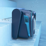 Underwater action shot of the Maytronics Dolphin Liberty 600 robotic pool cleaner navigating and climbing pool steps, showing blue water streams and air bubbles around its navy body and side tracks.