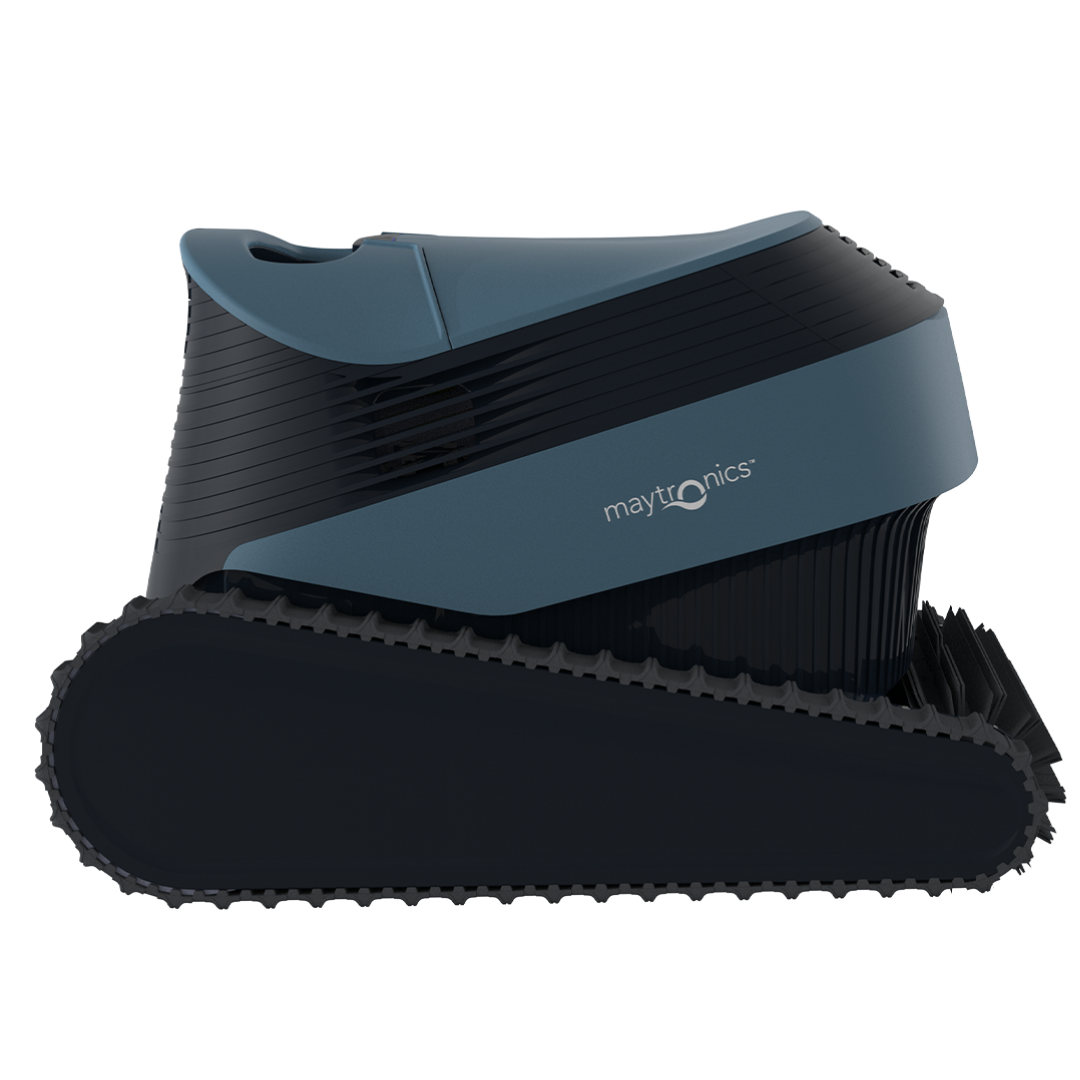 Side elevation studio product view of the Maytronics Dolphin S1000 robotic pool cleaner on an isolated white background, highlighting its continuous rubber track drive system, dark grey chassis, slate blue top casing with Maytronics branding, and front scrubbing brush profile.