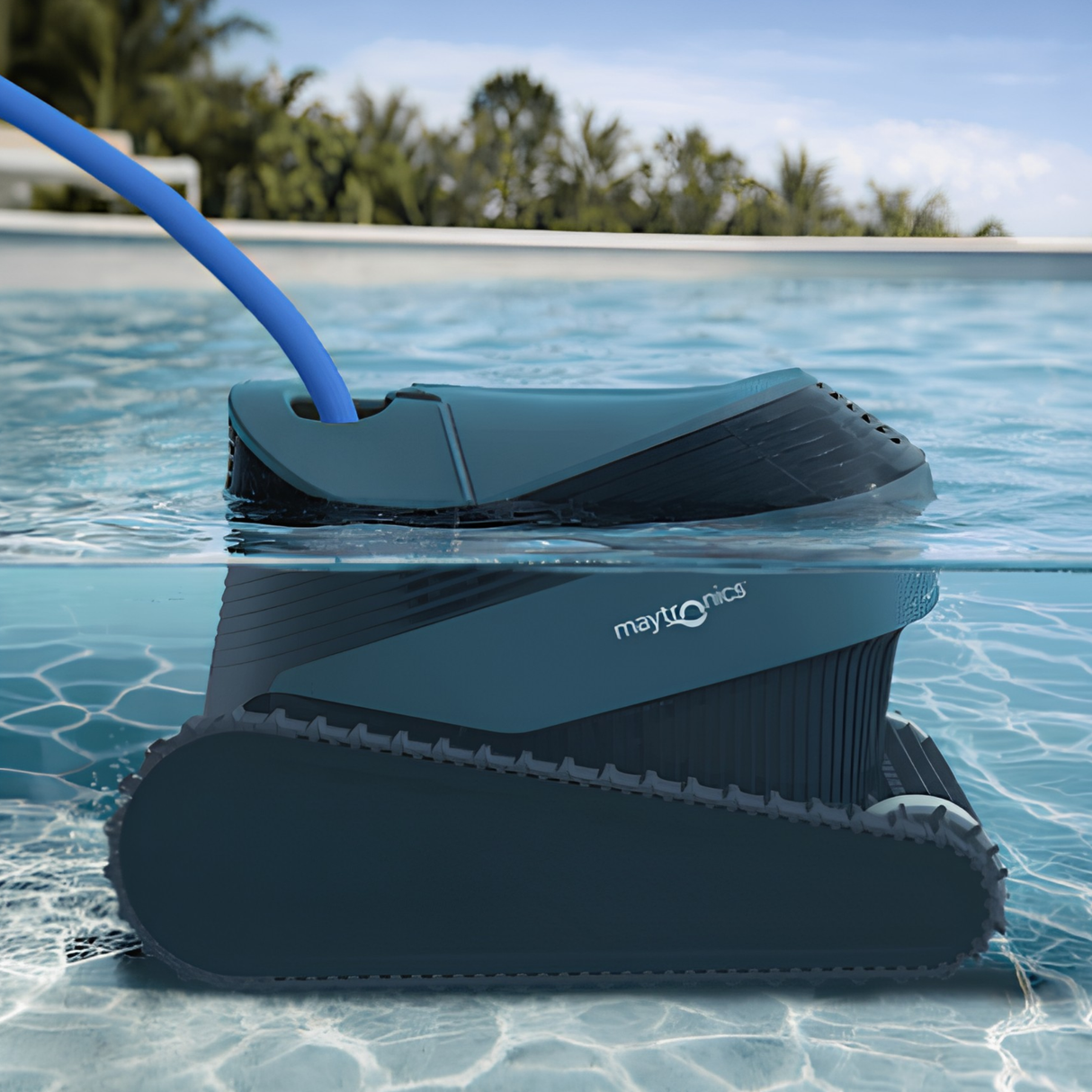 Maytronics Dolphin S1000 robotic pool cleaner operating submerged underwater inside a backyard swimming pool with a blue power cable