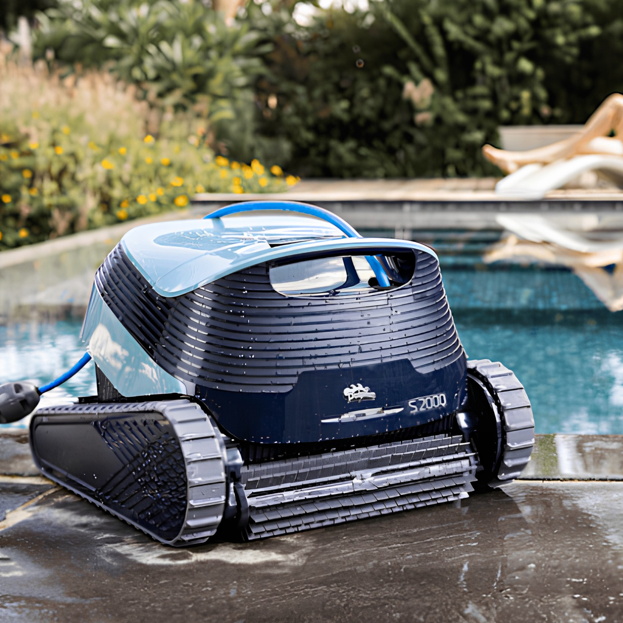 Maytronics Dolphin S2000 robotic swimming pool cleaner sitting poolside on wet pavement next to an outdoor in-ground pool.