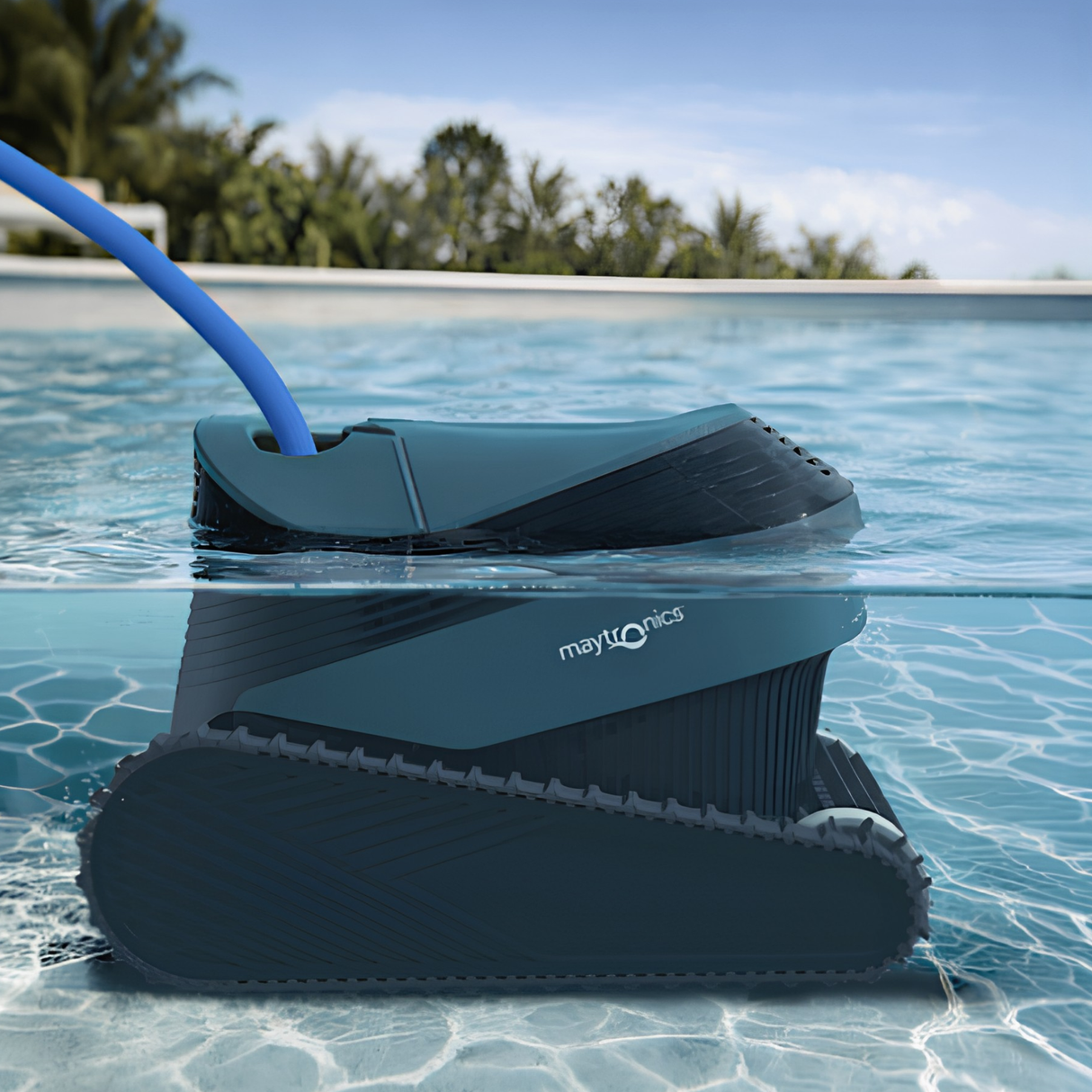 Maytronics Dolphin S2000 robotic cleaner scrubbing the waterline of an outdoor swimming pool with palm trees in the background.
