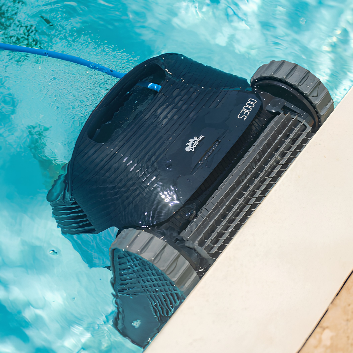 Maytronics Dolphin S3000 robotic swimming pool cleaner climbing and scrubbing the waterline edge of an in-ground pool.